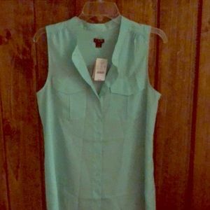 Teal sleeveless button up blouse